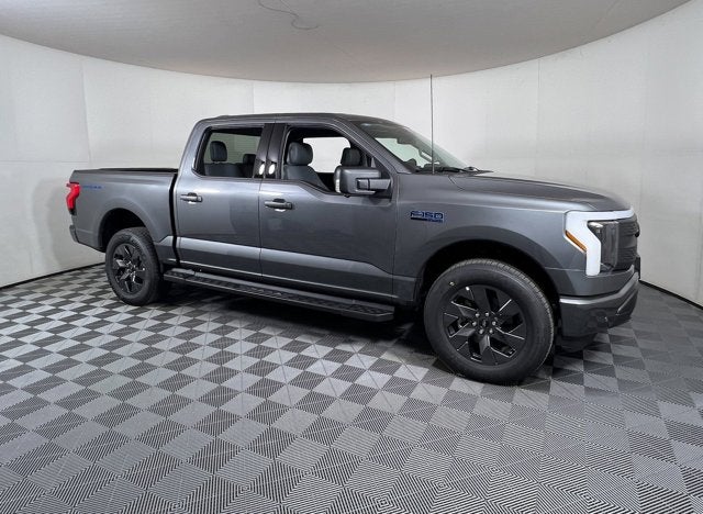 2025 Ford F-150 Lightning Flash in Gray Metallic — front three-quarter view